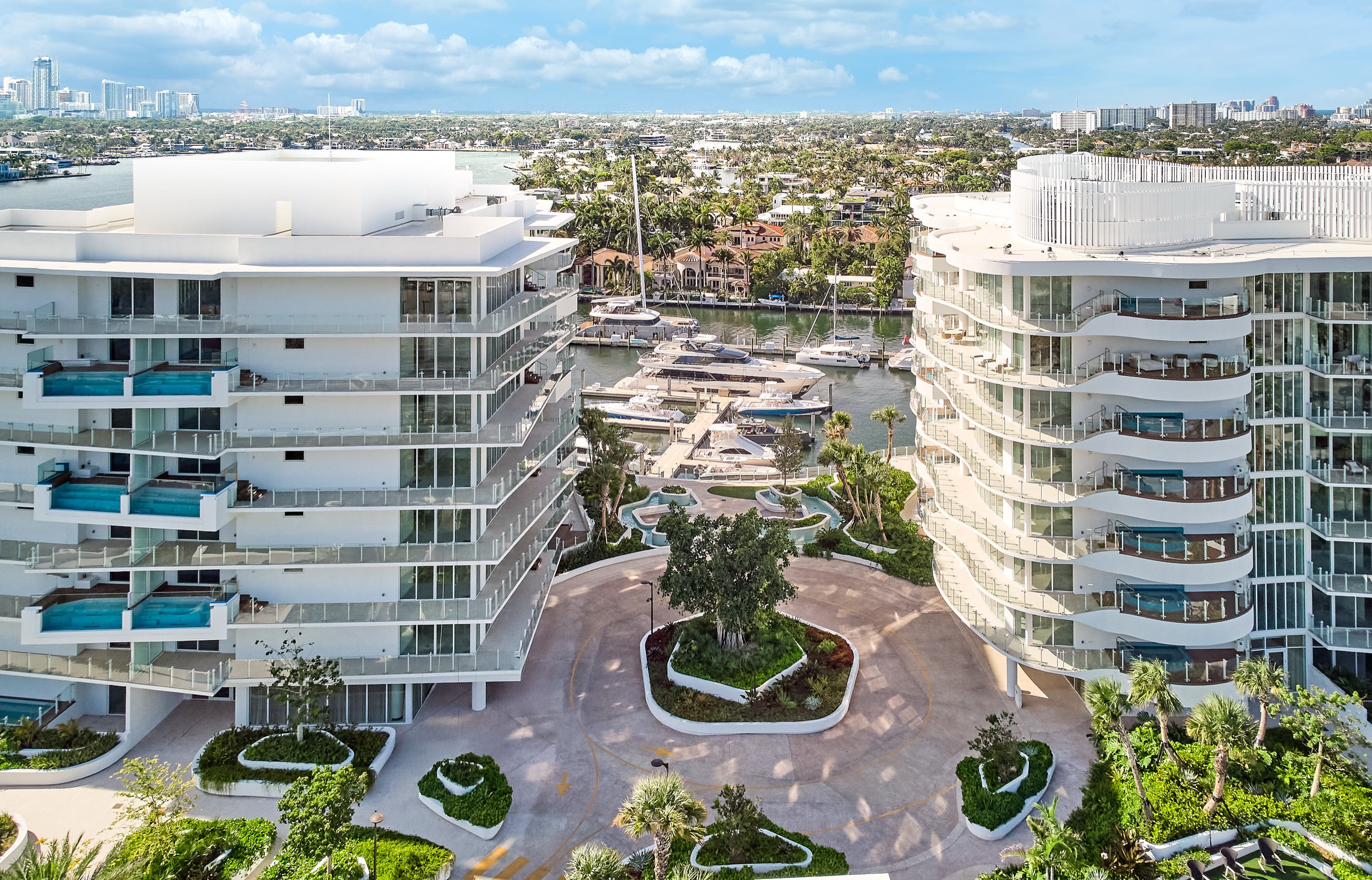 Indigo and Azul photographed from above, framing the residential court and the private basin