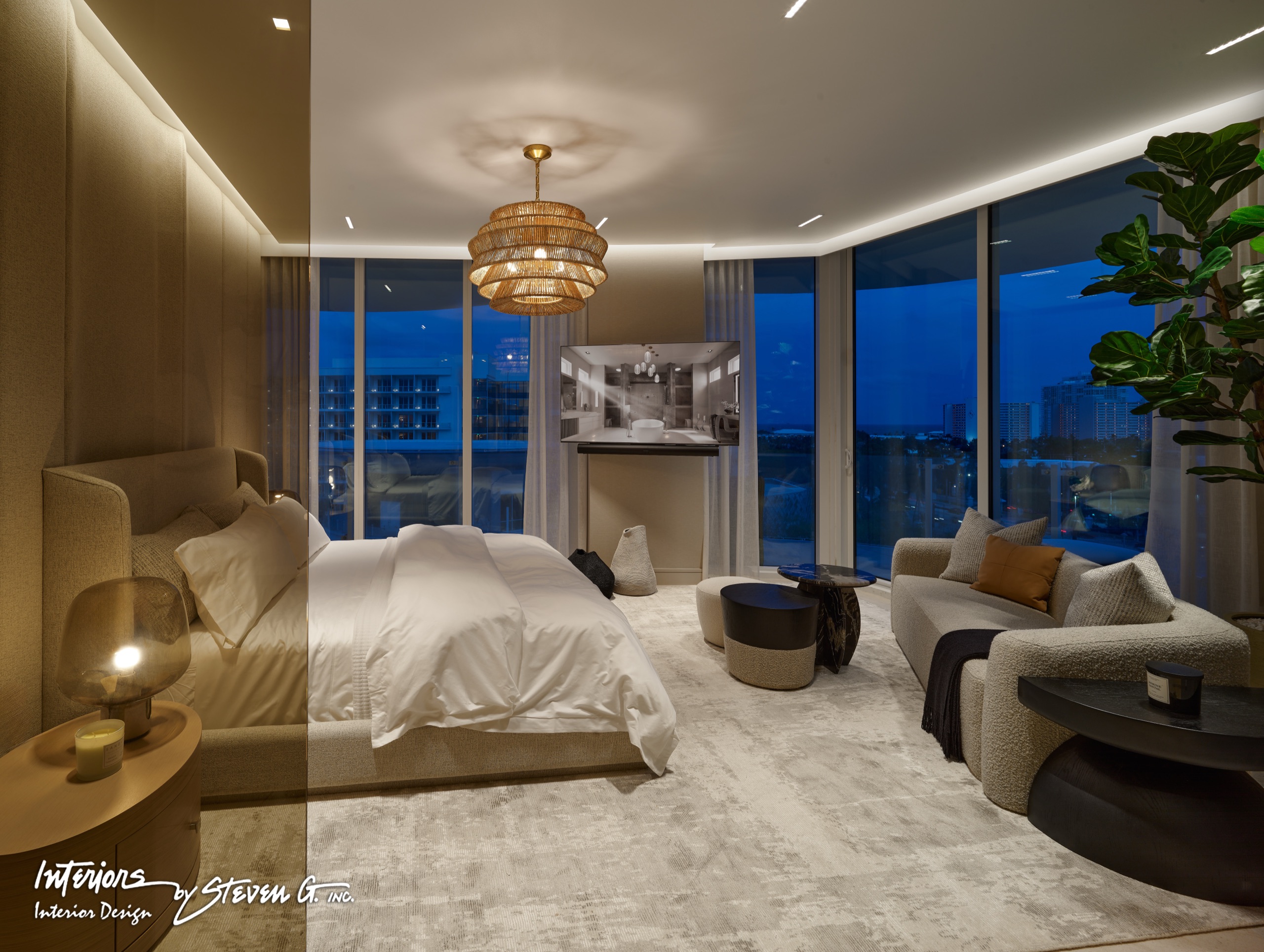 A primary bedroom at dusk under a woven chandelier, glass on two sides