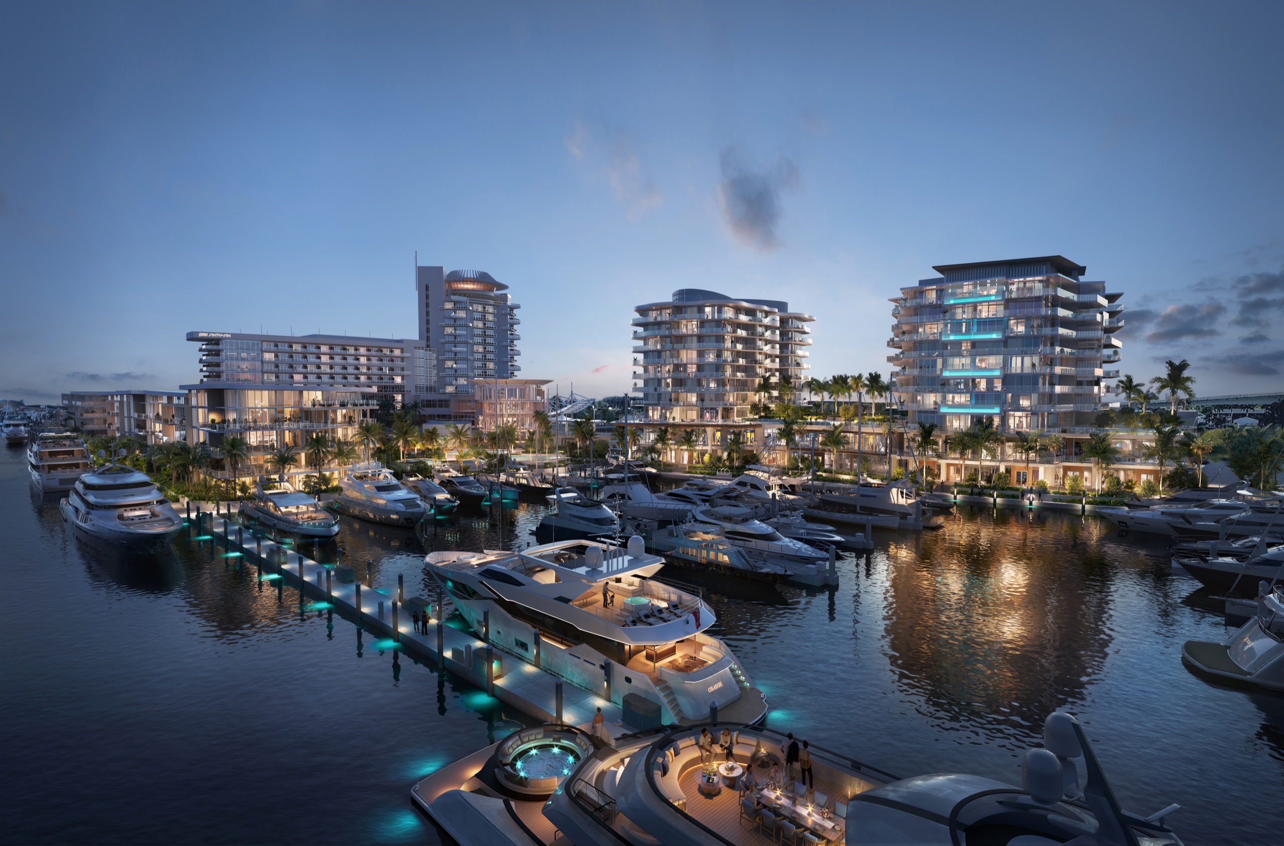 The resort at dusk from above the marina — the crowned tower, Azul and Indigo over lit superyachts